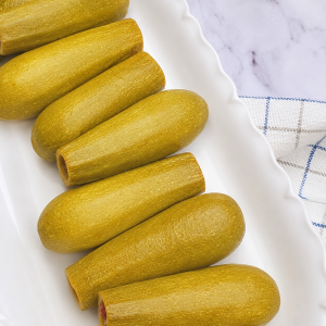 Koussa b Lahme – Zucchini Spiced Meat and Rice Baked in Grape Leaves Tangy Sauce